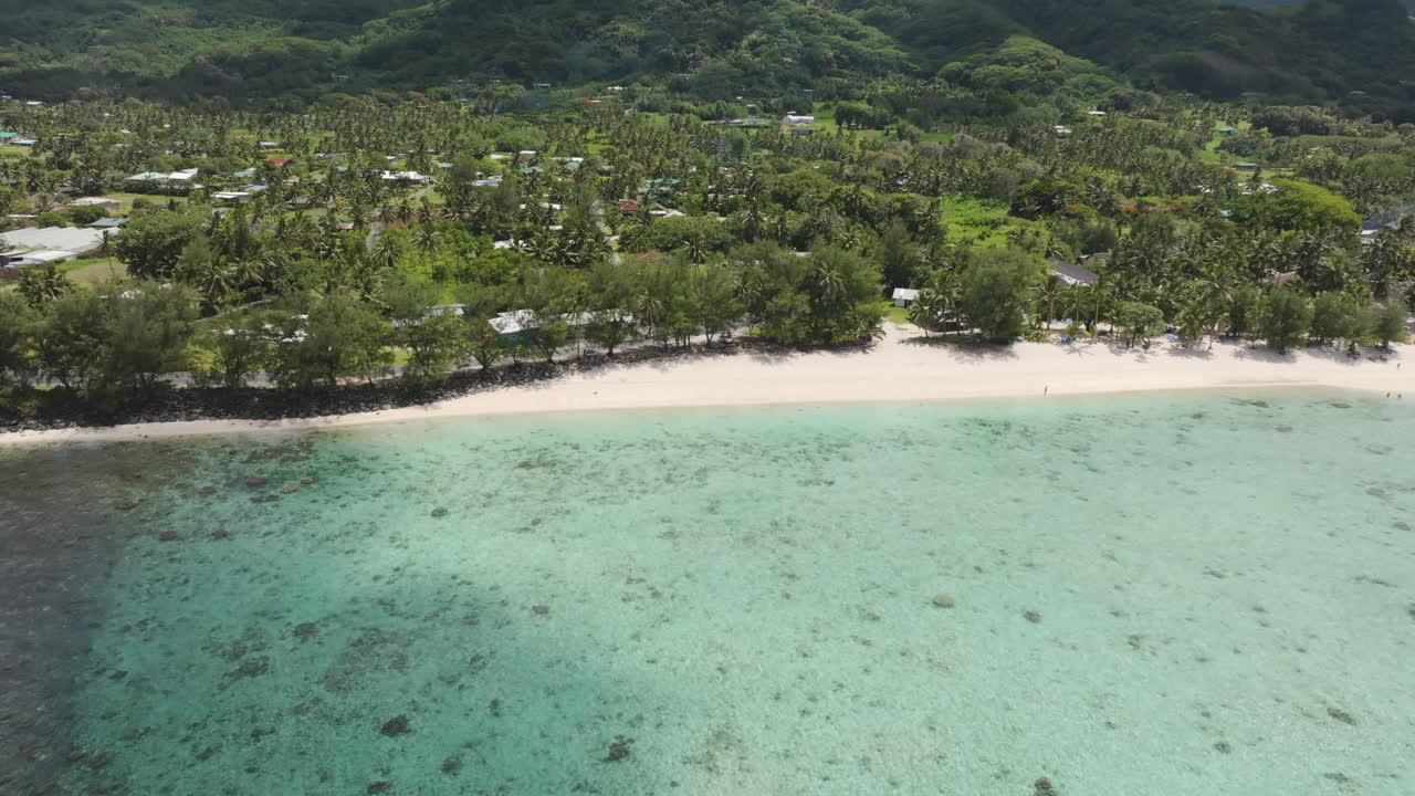 Drone high angle overview of Aroa Beach Lagoon Marine Reserve in South Pacific, Rarotonga Cook Islands with crystal clear waters