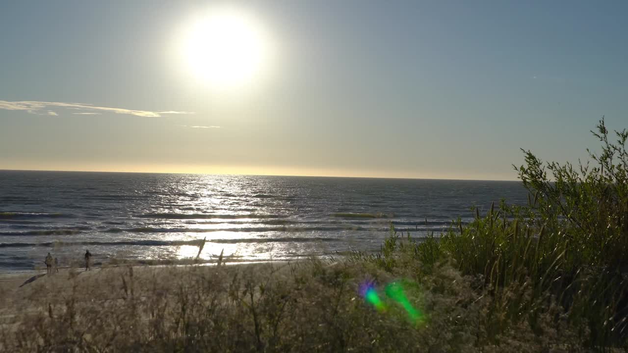 Sunset Over The Baltic Sea In Palanga. 4k. Palanga, Lithuania. Sandy Coast Of The Baltic Sea.