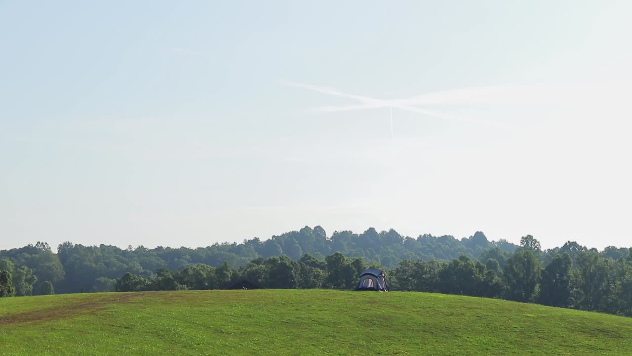 Tent On Top Of Hill Timelapse With Clouds And Sunbeams