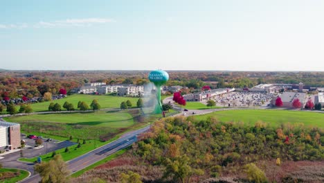 maintenance truck washes a towering water tank