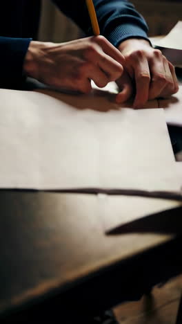 person writing at a desk