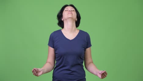 beautiful woman with short hair relaxing with eyes closed