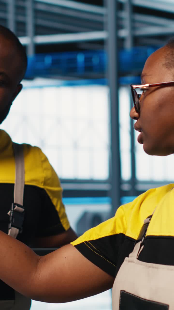Vertical video Photovoltaics smart factory elderly team leader talks with workers