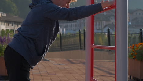 man stretching outdoors