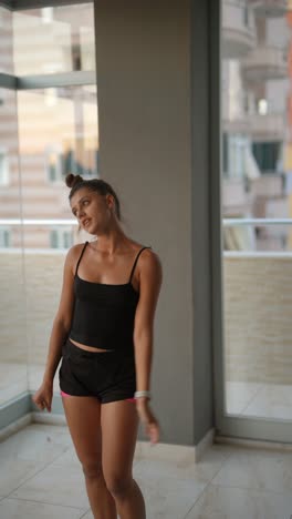 woman dancing on balcony