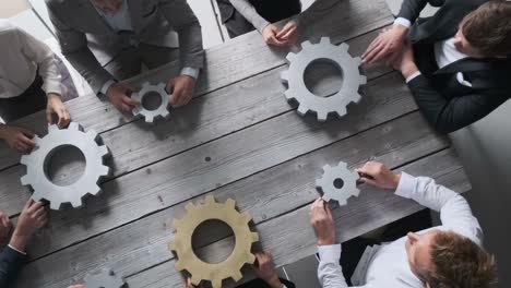 business people joining gears