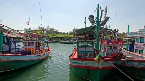 fishing vessels moored in a calm harbor