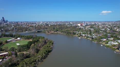 panoramic reveal of eleanor schonell bridge crossing brisbane river in dutton park, qld, australia