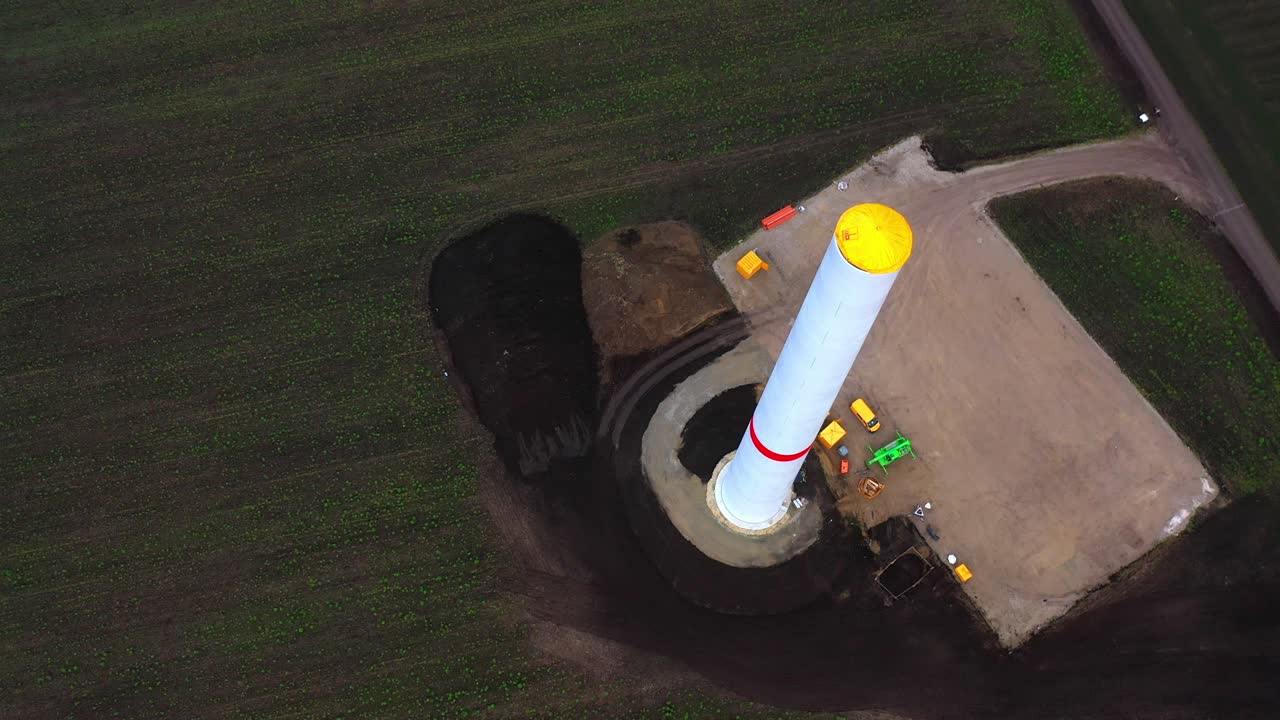 Tower Of Wind Turbine Under Construction - aerial drone shot