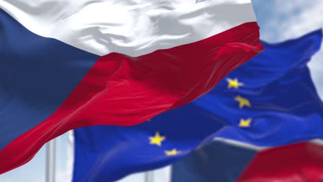 seamless loop of the national flag of czech republic waving in the wind with blurred european union flag