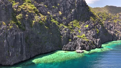 aerial perspective of the north of talisay beach, tapiutan island, in philippines