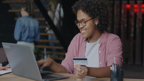 woman using laptop and credit card for online shopping