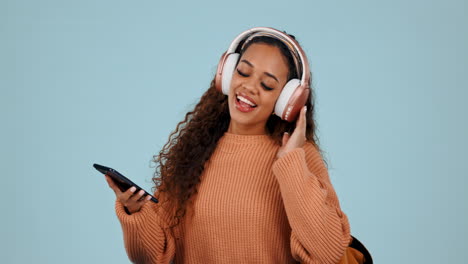 Dancing,-phone-and-a-student-woman-with-headphones