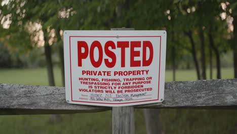 no trespassing sign posted on a fence near the joseph smith family farm, frame house, temple, visitors center, sacred grove in palmyra new york for the mormons and the book of mormon