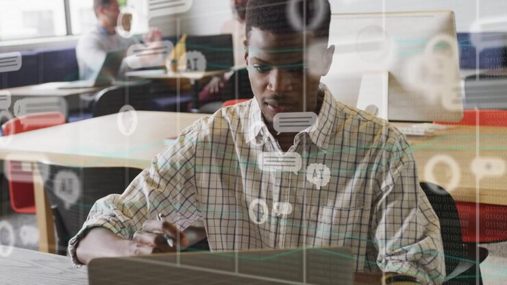 Male student moving from writing to typing in workspace, causing AI chat bubbles for study
