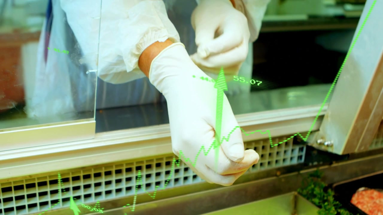 Food server pulling glove, tucking gown, preparing to serve with green overlays appearing on hands