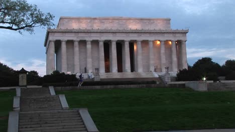 a jogger passes in front of the historic lincoln monument in washington dc