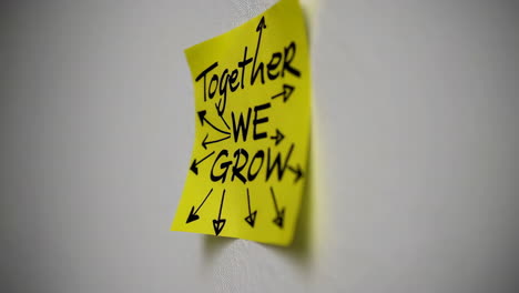 sticky note: together we grow