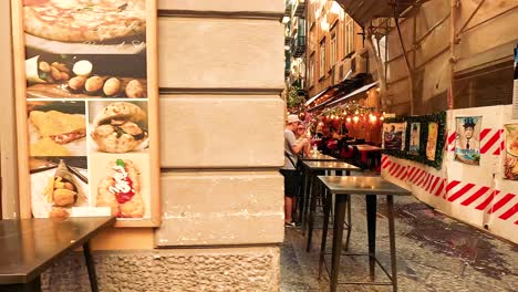 outdoor dining in a narrow naples alley