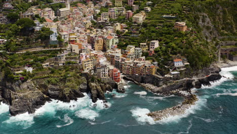 riomaggiore aerial pullback establishing, italy coastline