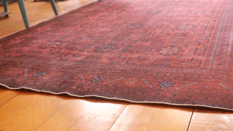 vintage red persian rug on wooden floor