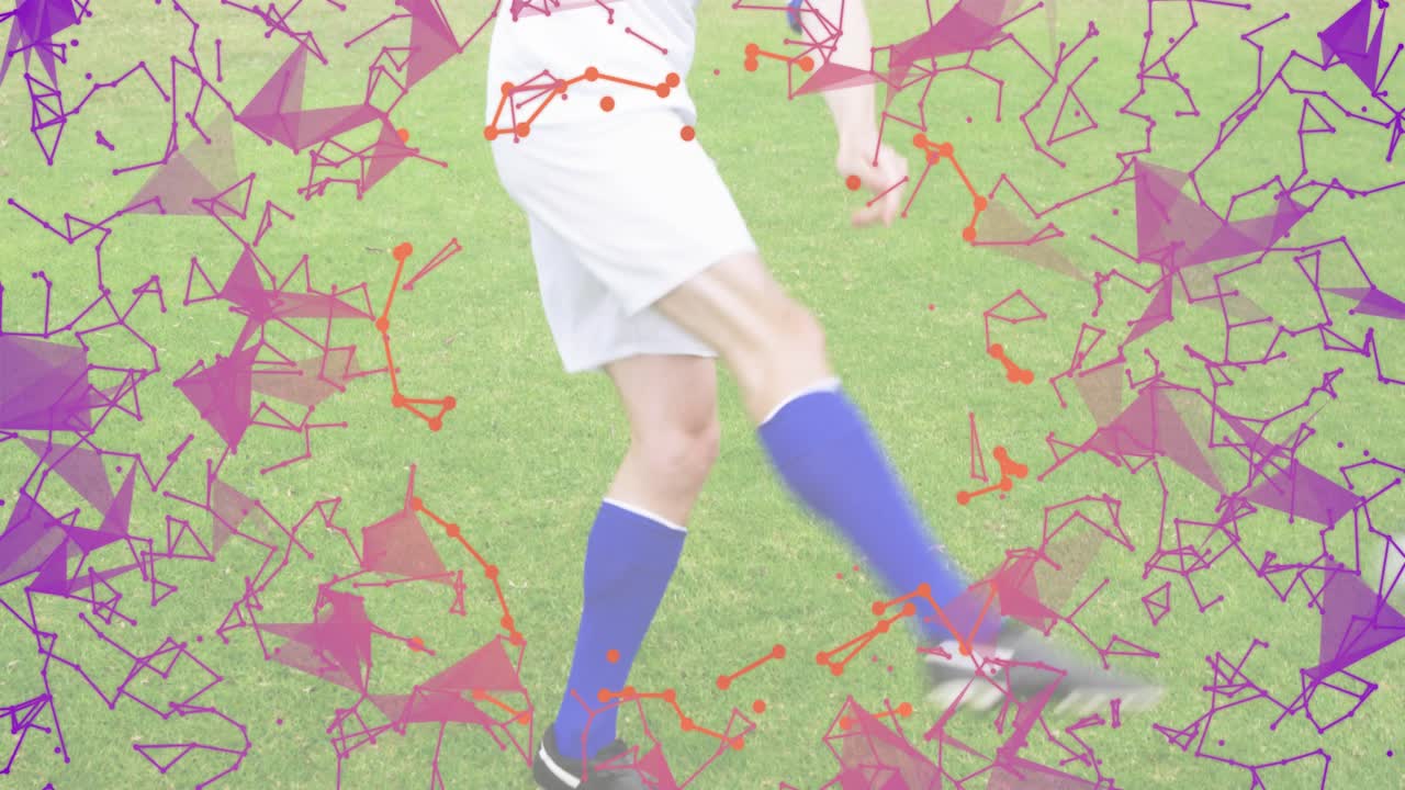 Male soccer player training juggling by tapping descending ball on pitch with swirling particles