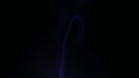 colors smoke in dark background