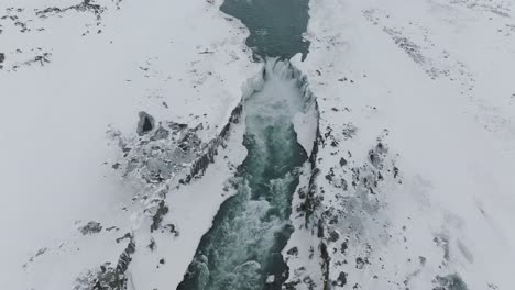 winter scenery above dettifoss waterfall in north iceland, aerial