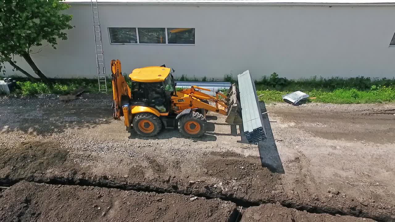 Aerial shot of construction site. Industrial excavator working on construction site