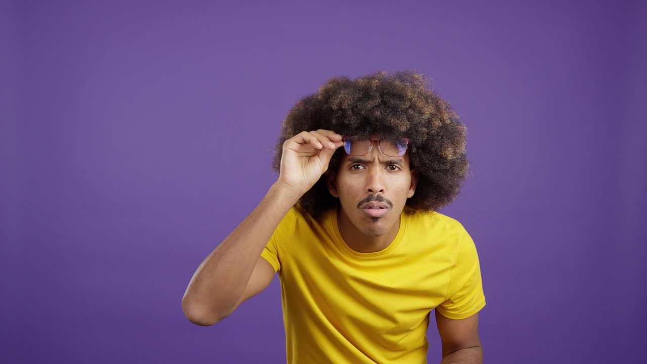 Man with Afro and Glasses Showing Different Expressions