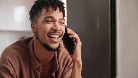 man having a phone call in the kitchen