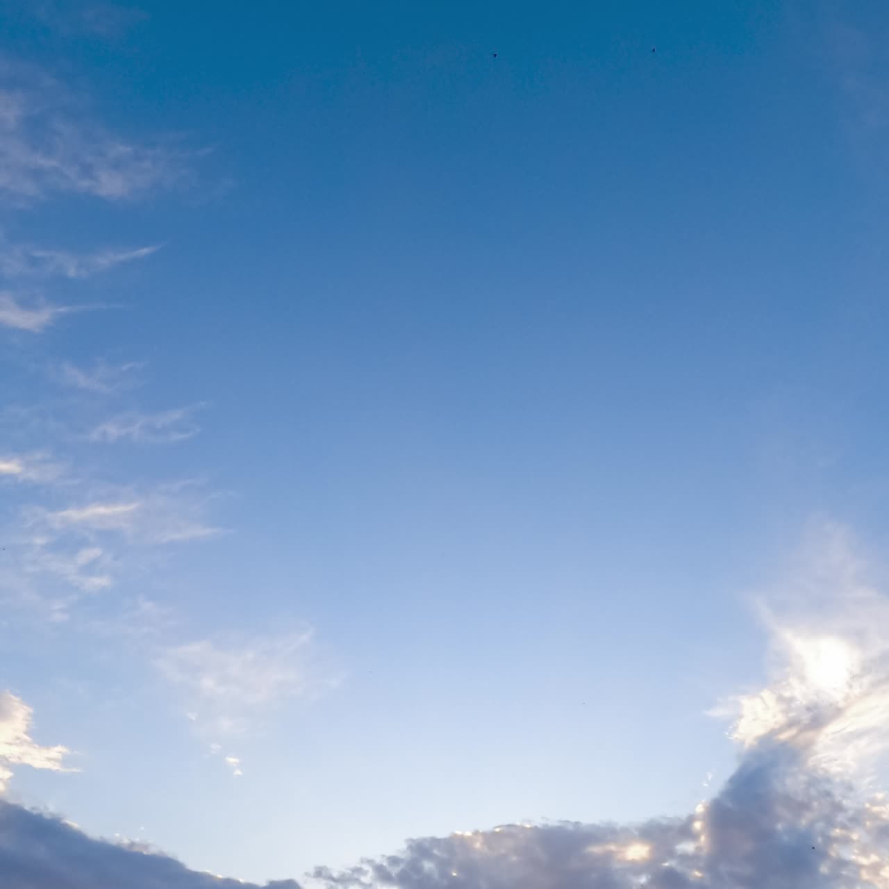 Light beautiful clouds flying along the blue sky. The skies cleaning from the cloudscape. Low angle view timelapse