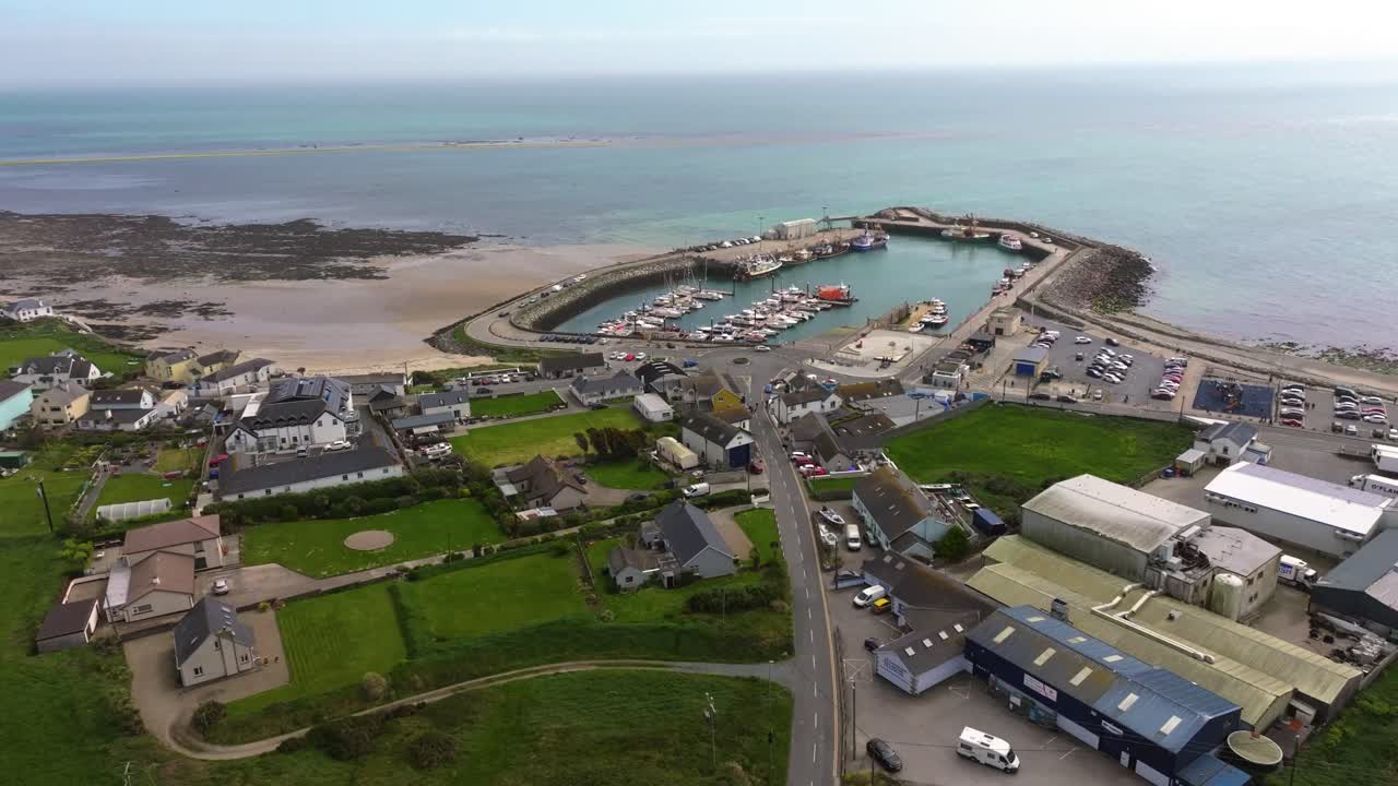 4K cinematic drone footage capturing Kilmore Quay, Co. Wexford, Ireland, on a bright day, showcasing the picturesque harbour, and colourful fishing boats Co.Wexford - Ireland_022