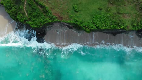 un vuelo sobre esta hermosa playa en bali, dreamland es un nombre apropiado para este pedazo de paraíso