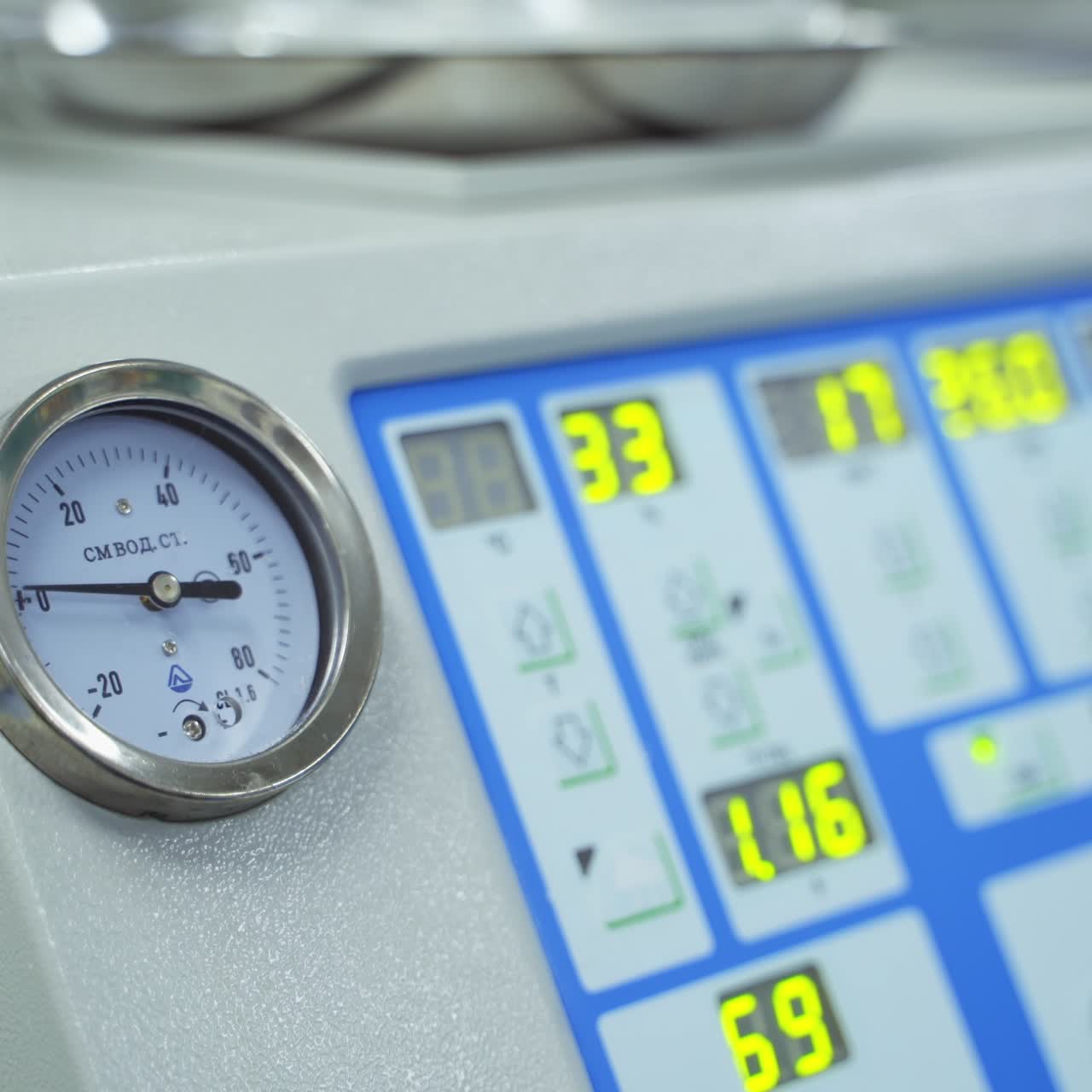 Medical apparatus with clock face and moving hand during surgery. Close up. Technical appliances in modern clinics
