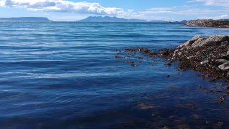 Push-out-shot-by-the-water-on-blue-ocean-beach-island