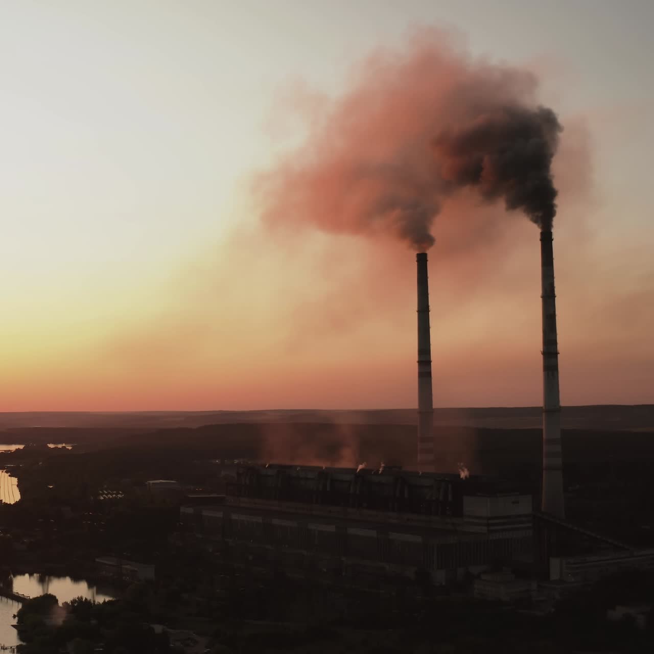Aerial view of factory with pipes. Aerial view of plant with high factory structure at industrial production area