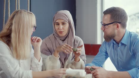 diverse group discussing over coffee