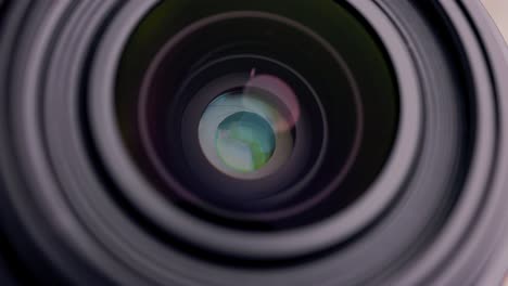 camera lens focusing, aperture blades opening and closing, close-up detail view of mechanism