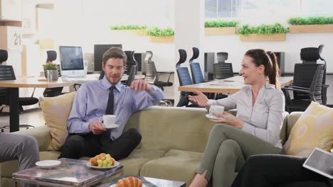 group of executives interacting while having coffee 4k