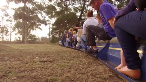 a ground level view of a moving miniature train