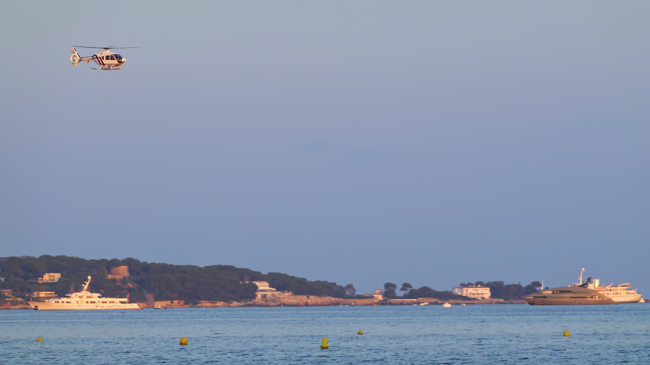 Helicopter flying above the sea in Cannes, France