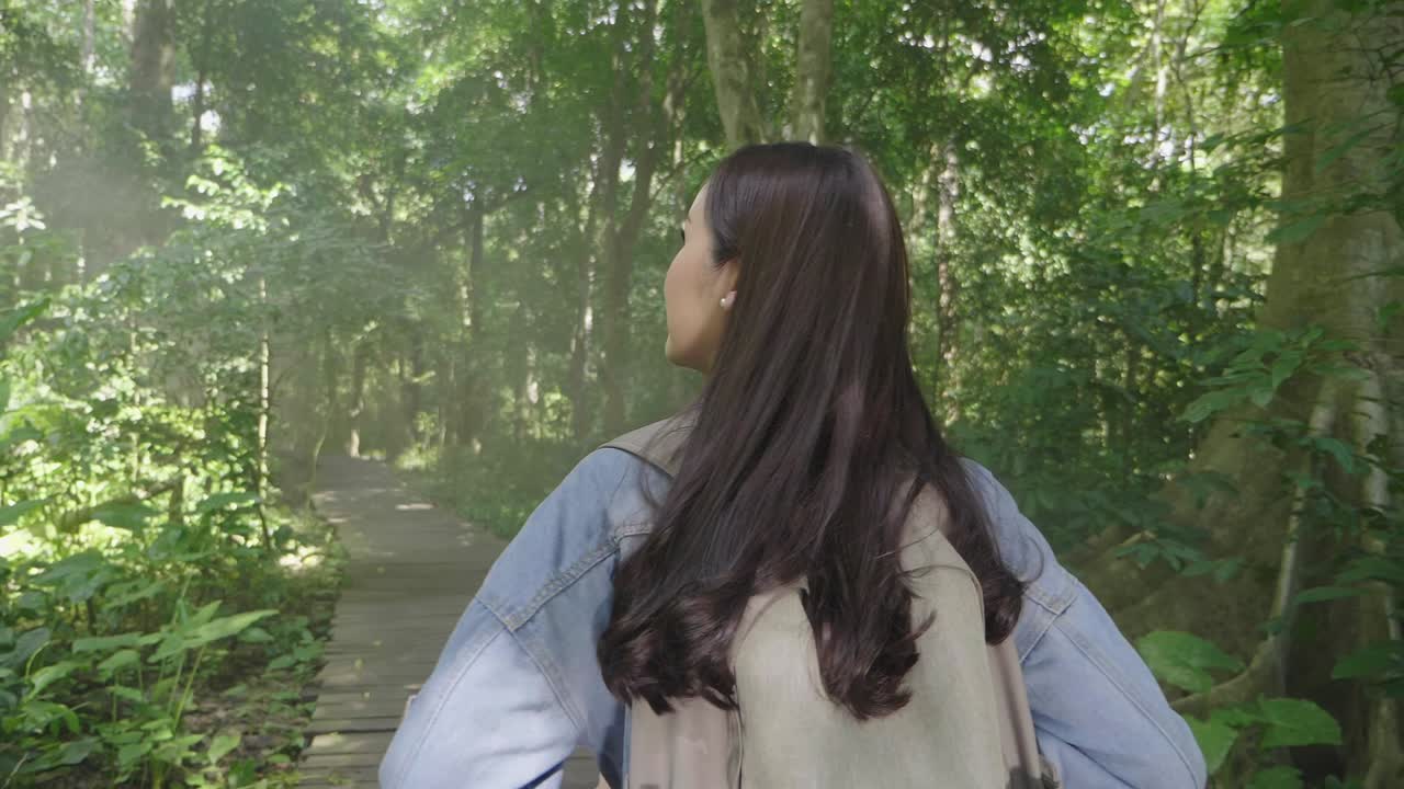 Girl Walking On Wooden Path In Forest, Slow Motion