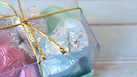 heart-shaped chocolates in a transparent box