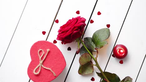 fresh red rose flower on the white wooden table