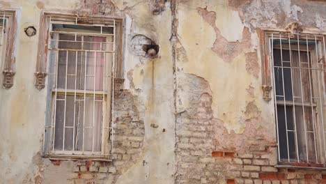 old building exterior with damaged facade