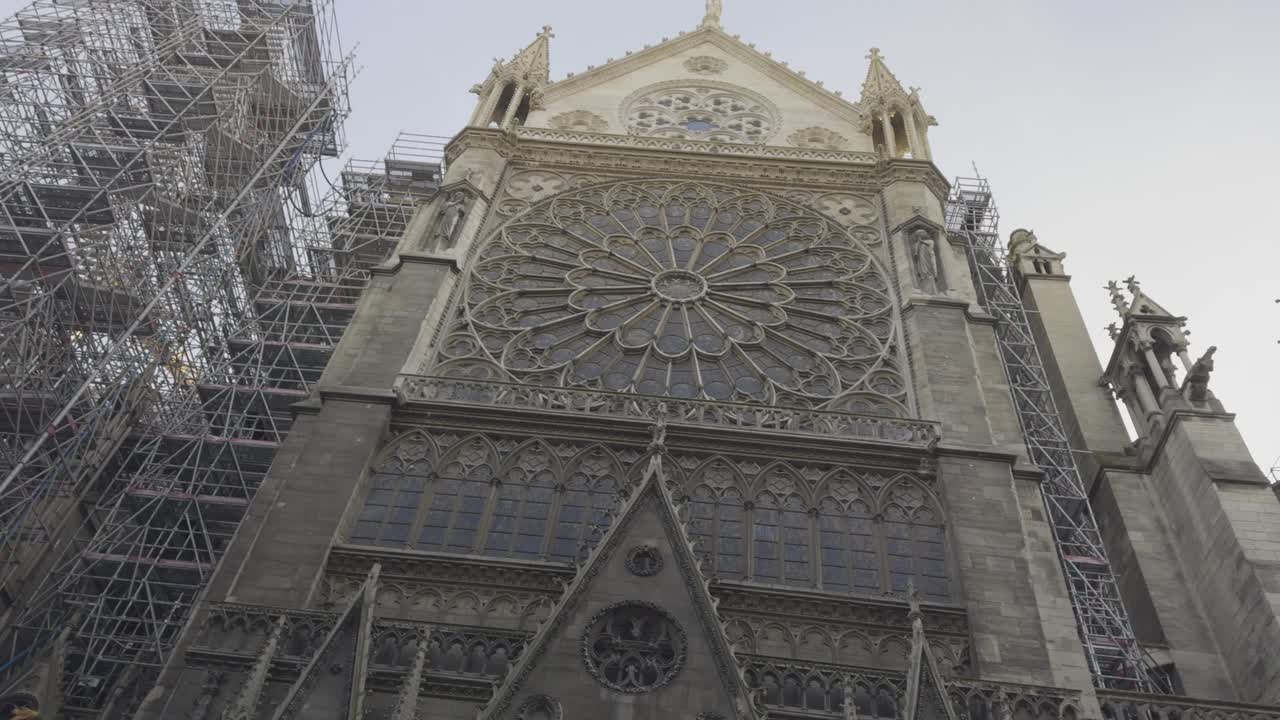 Notre-Dame Cathedral during restoration with scaffolding, Paris, France. Low-angle pov