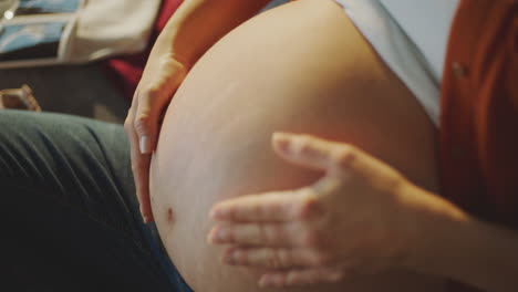 pregnant woman caressing her belly
