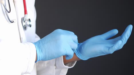 doctor putting on gloves