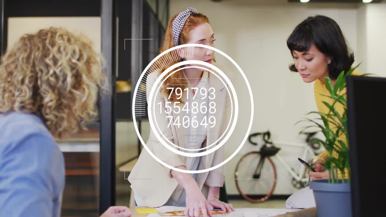 Team plotting business plan in office, displaying sticky note diagrams and digital HUD overlay